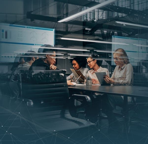 Revenue team reviewing performance around a table